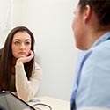 Teen female talking with nurse